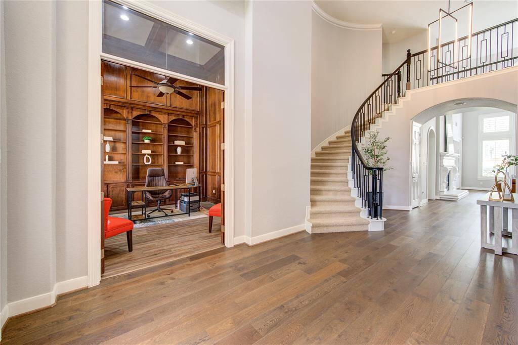 Step inside to soaring ceilings and a sweeping view into the richly appointed front office—an inviting entrance that blends function with sophistication