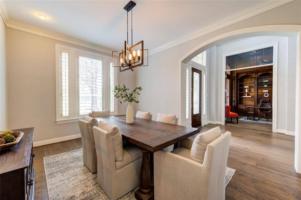 Impress guests in the formal dining room with seamless flow from the foyer for effortless entertaining