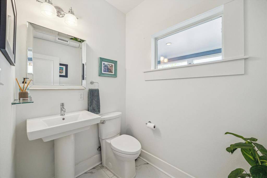 The half bath is tucked away by the back door.