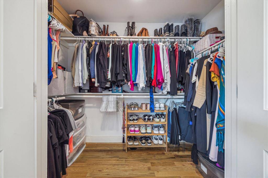 Primary bedroom walk-in closet #1.