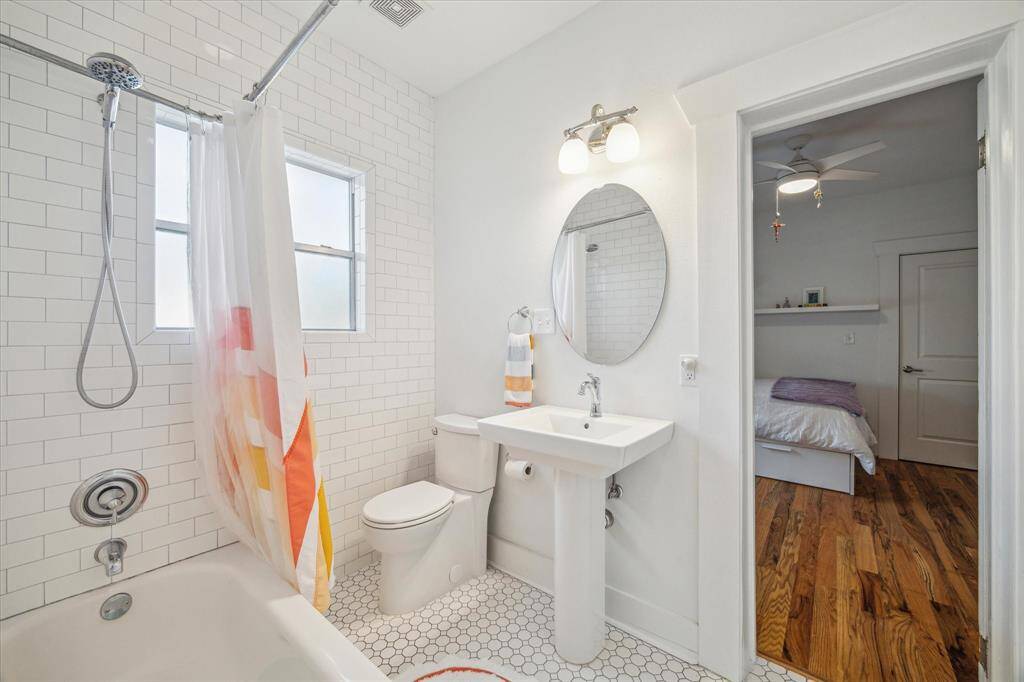 This jack and jill bath connects guest bedroom 1 & 2, and is cute as a button!
