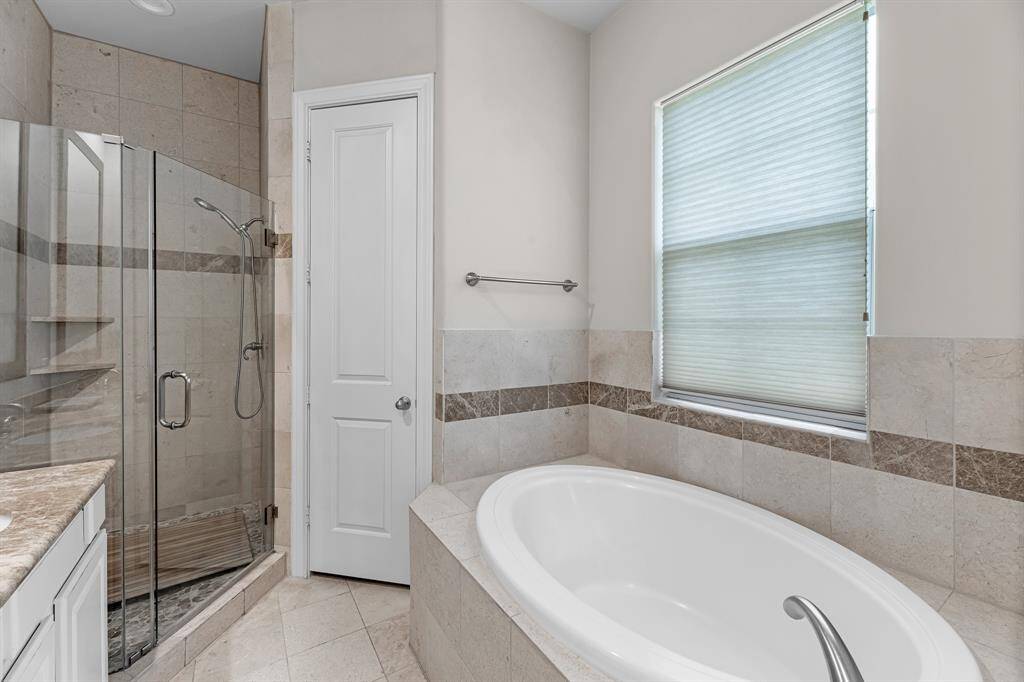 Primary on-suite tub/shower combo.