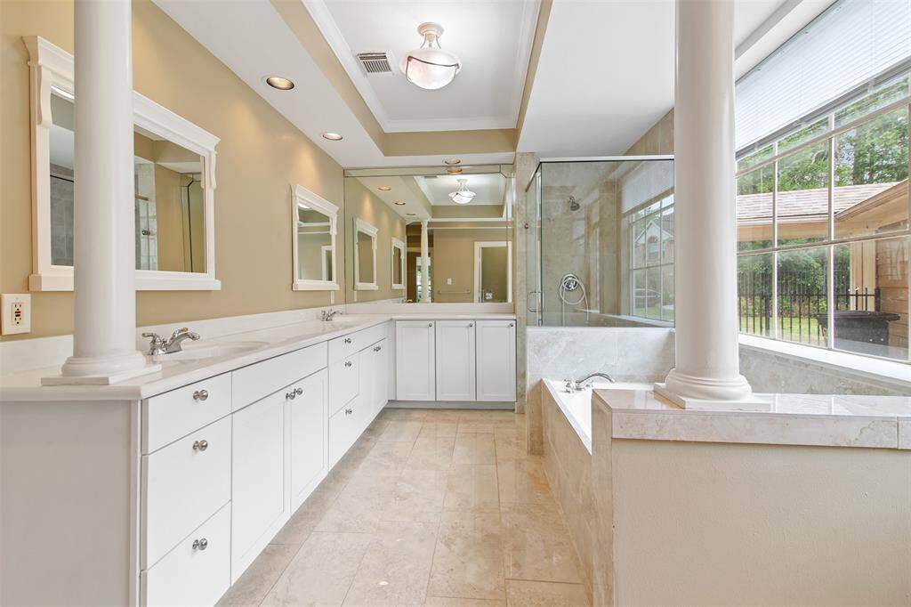 Primary bathroom also has double sinks and plenty of storage.