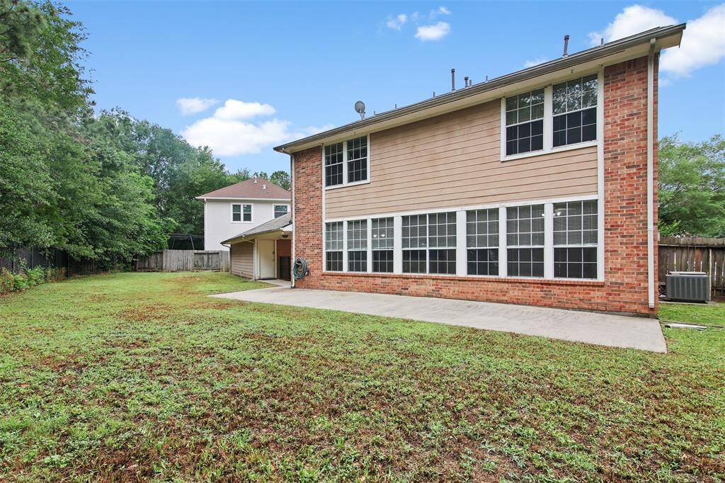 Backyard of home has patio and plenty of space for the kids to play.