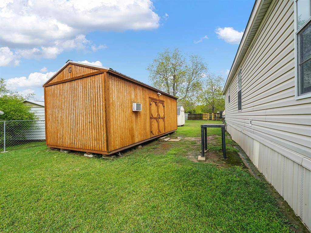 Insulated shed with AC. Ideal for a man cave, she shed, or creative studio