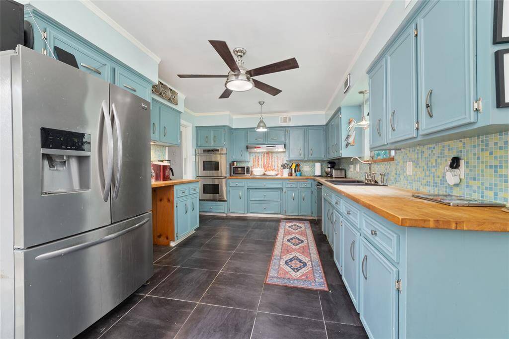 A closer look at the kitchen reveals smart storage solutions and a spacious layout. Perfect for meal prepping, cooking, and gathering.