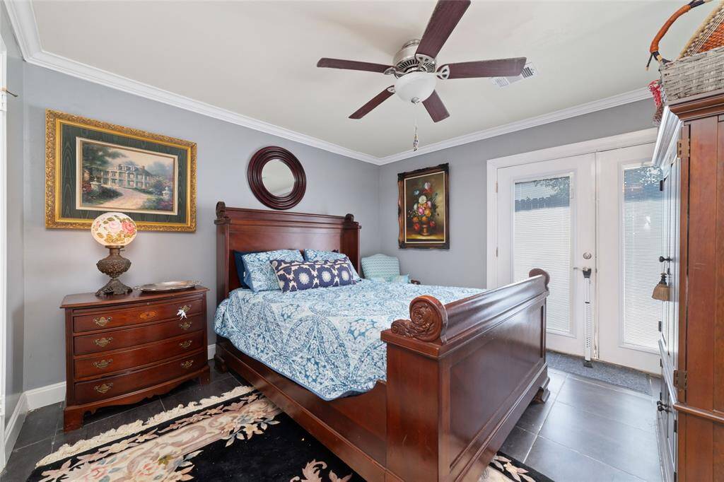 Guest bedroom with backyard access and plenty of natural light. The layout works well for a guest suite