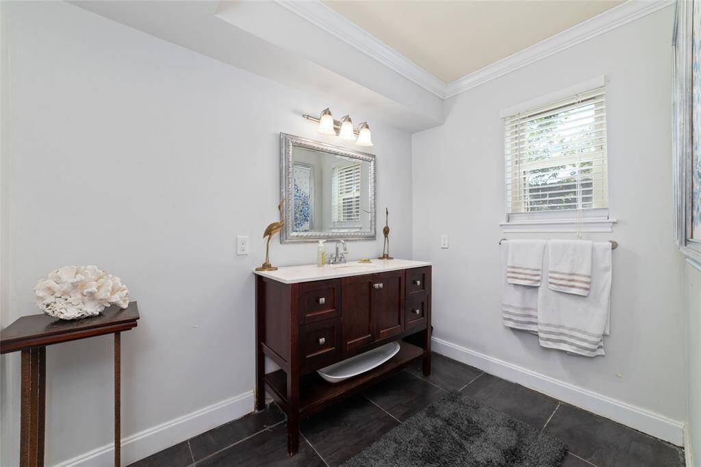 Guest bath with updated vanity and modern lighting. A thoughtful addition for guests.