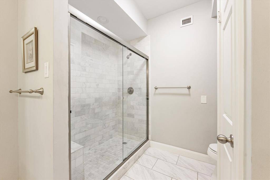 Enjoy the large, spa-like shower in the primary bath, complete with a bench for added relaxation and ease.