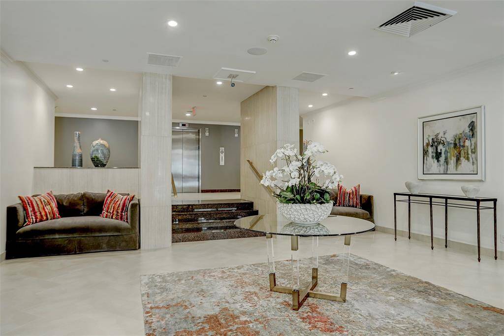 The sophisticated lobby provides a gracious welcome for your guests, reflecting the refined ambiance of Woodway Place II.