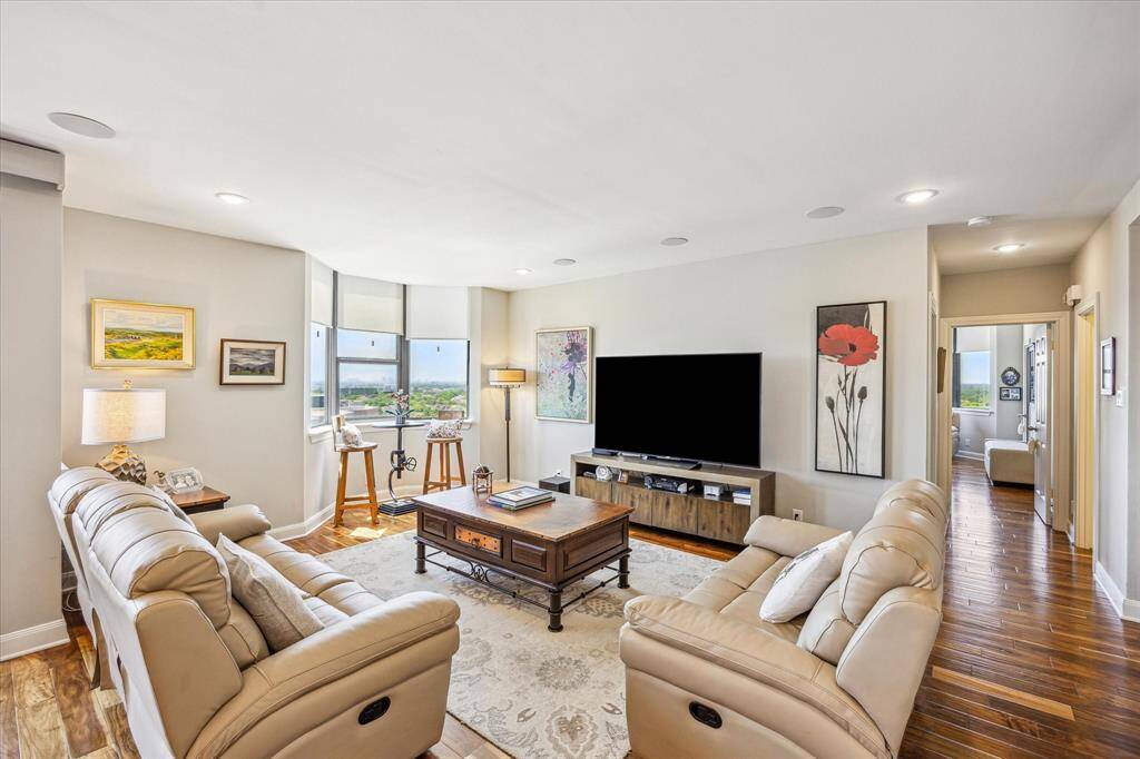 The expansive living area offers flexible furniture placement and abundant seating for entertaining or everyday comfort.