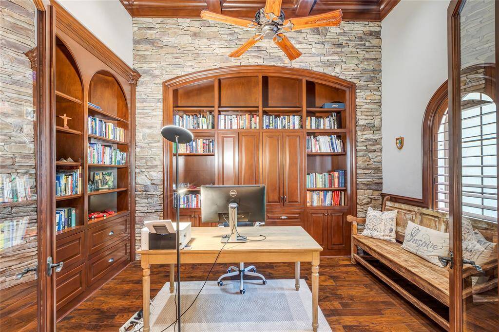 Office/Library area with wood floors and wonderful built-ins.