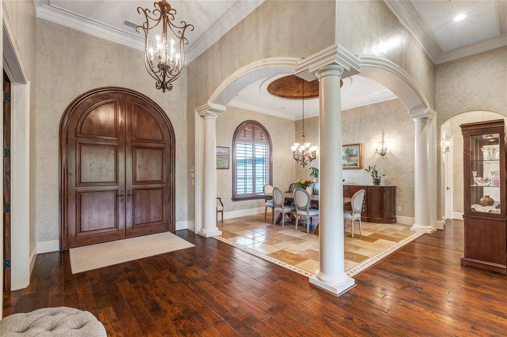 Stepping inside the home with dining room to the left and office/study to the right. Beautiful wood floors.