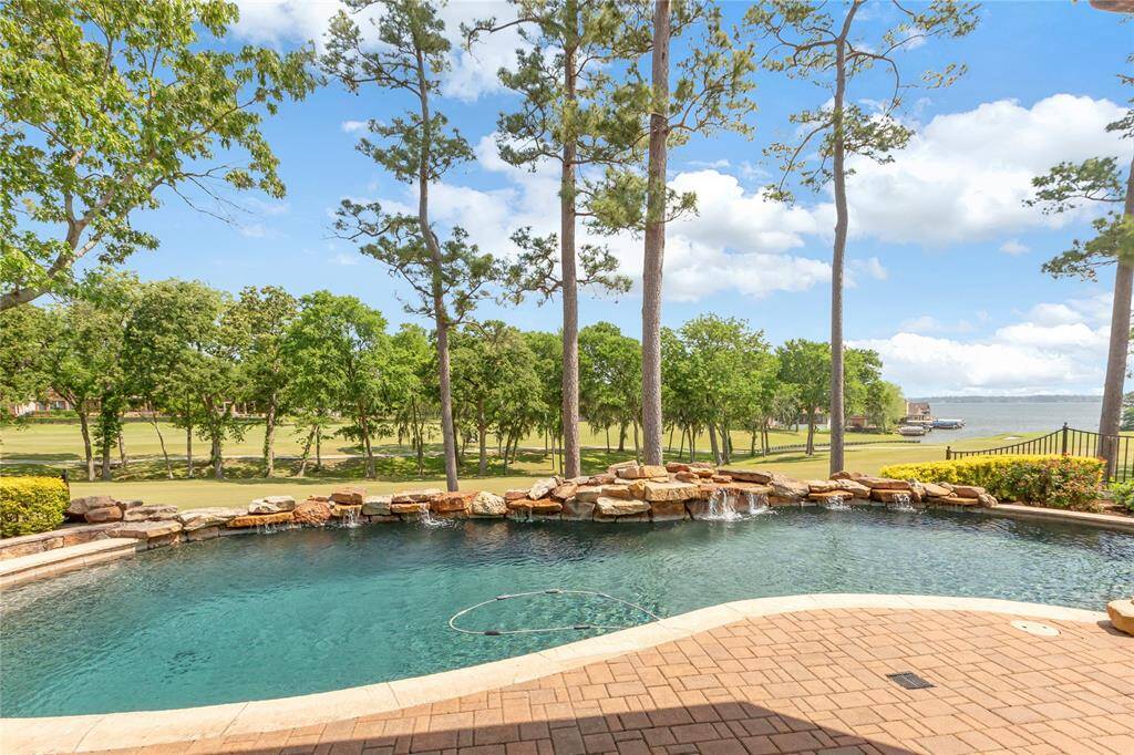 Salt water pool with water fall on the Weiskopf #12 with Lake Conroe views.