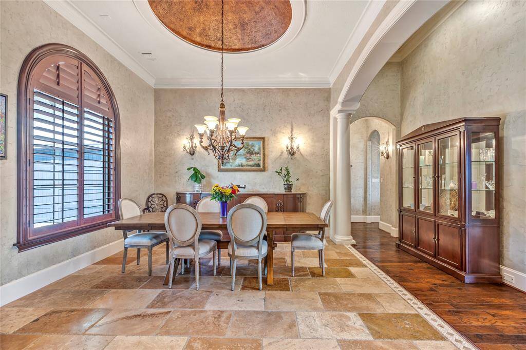 Stunning domed ceiling with wooden shutters and tile floor.