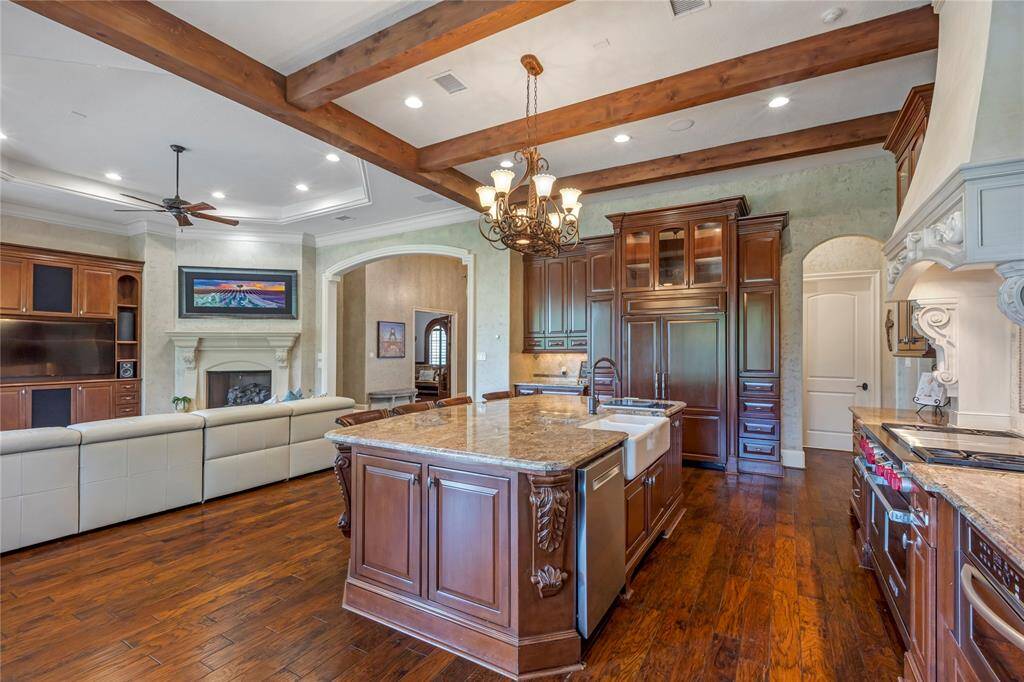 Preparing meals in this kitchen with the open views into the living area along with excellent views of golf course and Lake Conroe.
