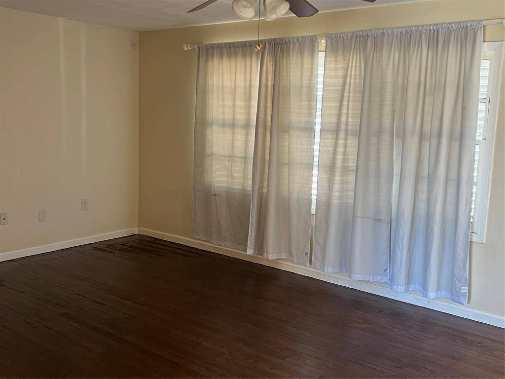 Living area with gorgeous wood floors.