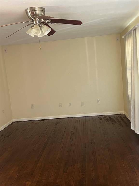 Living area - different angle. Fan and open to the breakafst room.
