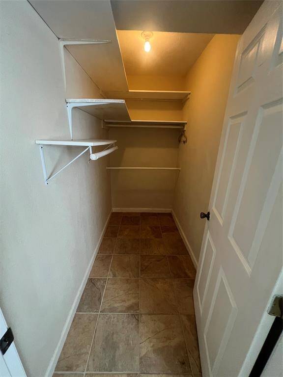 Primary rooms walk in closet.