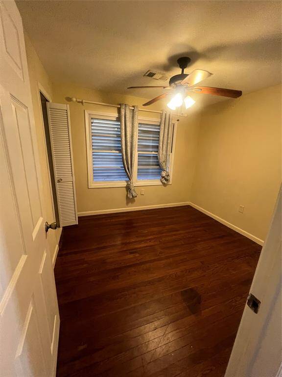 3rd bedroom. Gorgeous floors & fan.