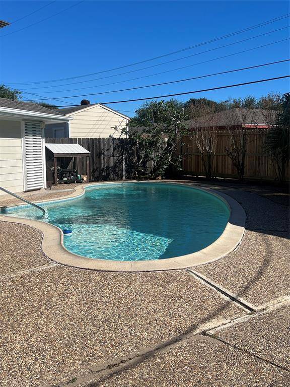 Another picture of fenced backyard.