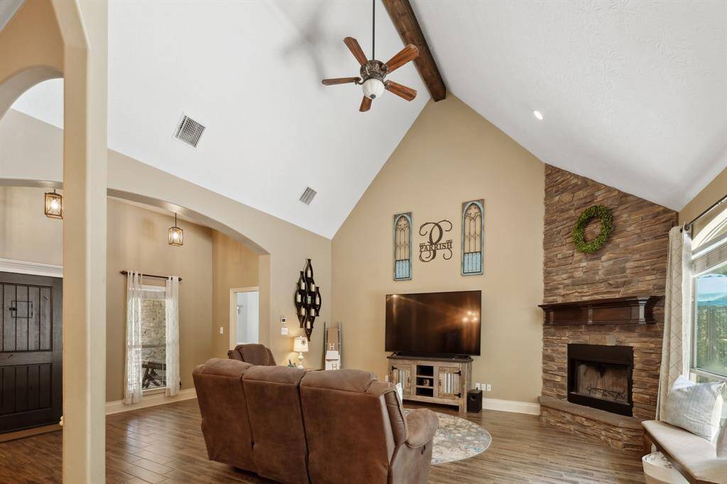 This space is fit for a King, and it easily accommodates a King sized bed, dressers, chest of drawers, and night stands!  Notice the cozy carpeting, ceiling fan with lights, custom window blinds, wide base moldings, and those views! What a way to wake up in the morning.