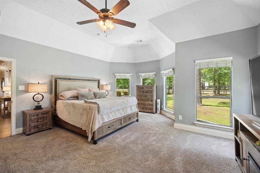 Don't miss all that built-in storage at the Her side of the bathroom!  The rain glass above the jetted tub provides privacy but also allows natural light to fill the space