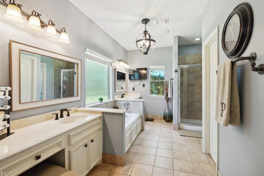 View from the back of this secondary bedroom looking past the door and down the hall towards the front door.