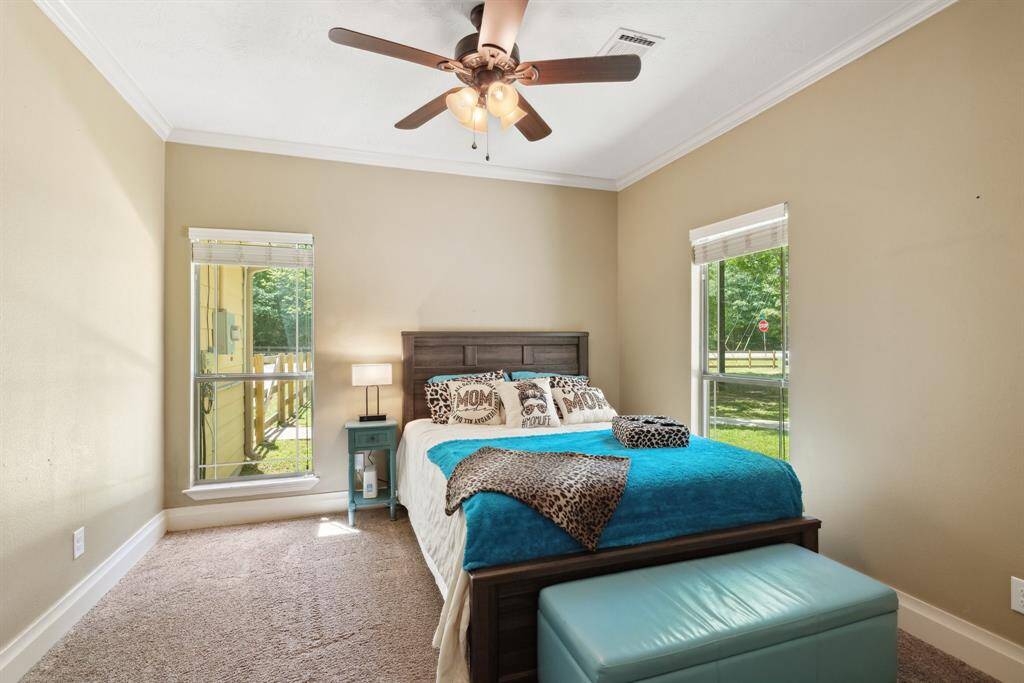 The home's 3rd bedroom is almost as large as a 2nd owner's retreat. Large windows overlook the front yard providing peaceful views and tons of natural light. Other features include cozy carpeting, custom 2" window blinds, gambrel style ceilings, and a walk-in closet.