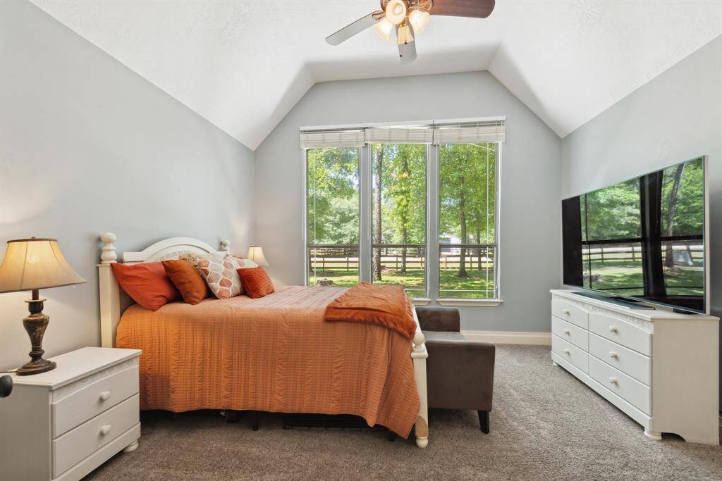 Don't miss the wide base moldings, crown moldings, ceiling fan, open shelving, and built-in desk.
