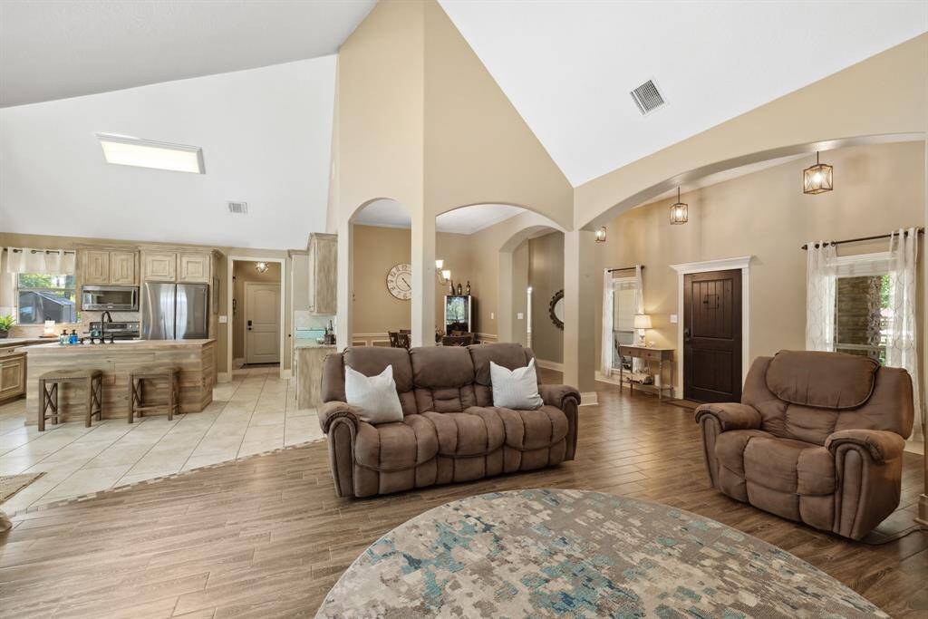Whether you're hosting dinner for a special occasion or for the holidays, the formal dining space is the perfect place for family and friends.  Notice the chair rail, panel moldings, and crown moldings that help make this space standout.  Add a rug for softness but these easy to keep clean tile floors are a dining room's best friend!