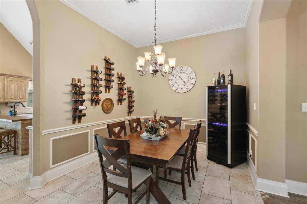 View from the formal dining room looking back toward the family room.  Notice how the wide archways help define the space without taking away from the open concept layout.