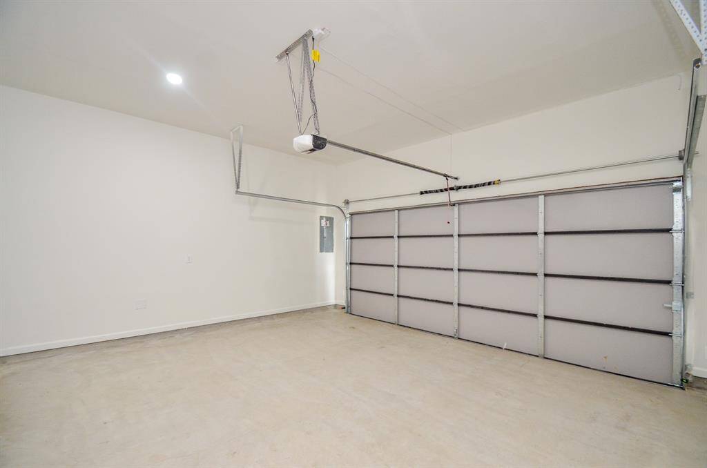 This garage features 10+ f.t ceilings and comes with an automatic double garage door opener.