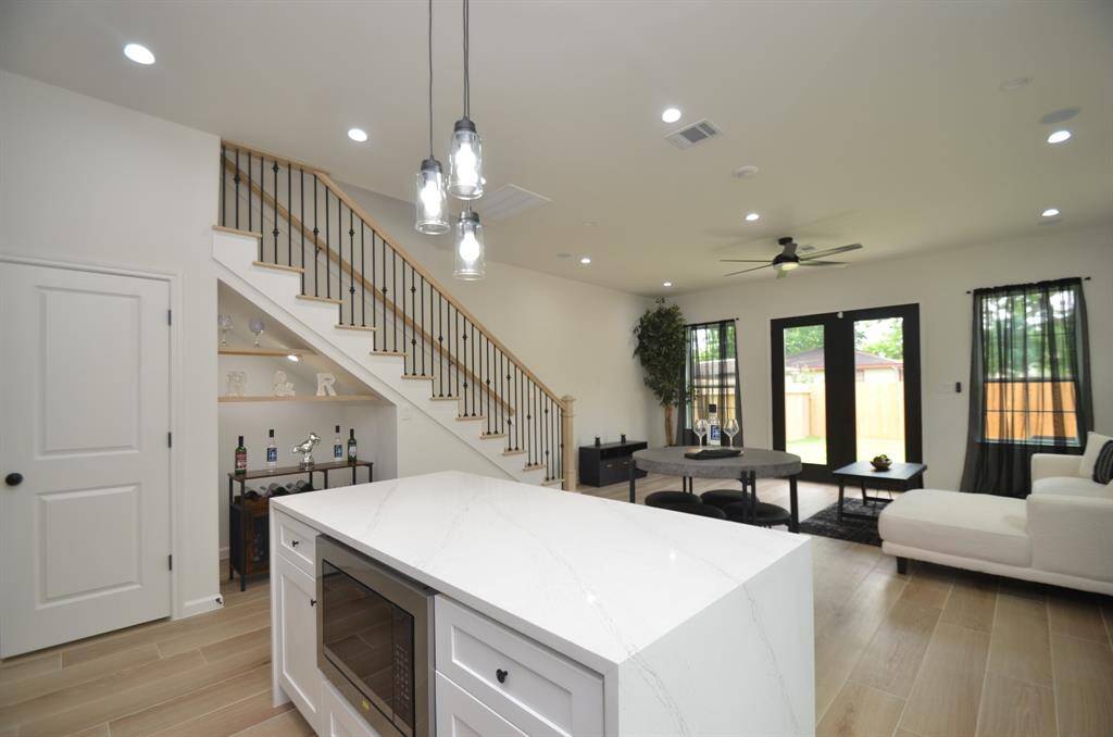 Large island with microwave built-in and soft closing cabinets drawers.