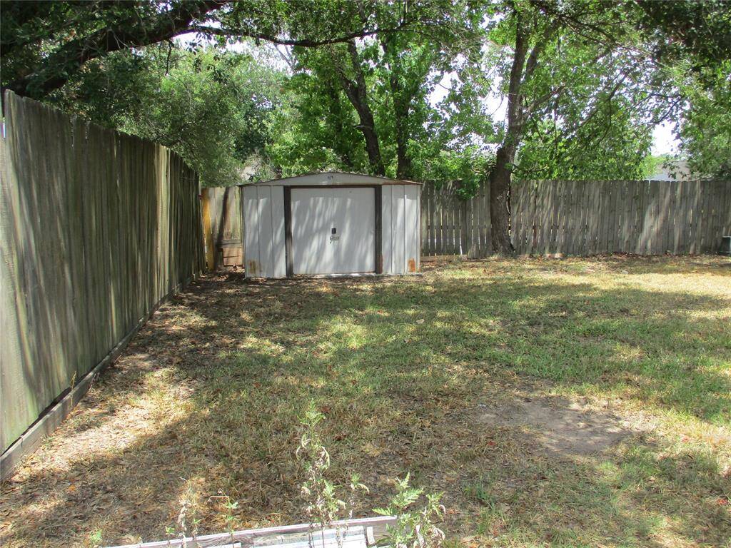Storage shed in back yard stays well shaded