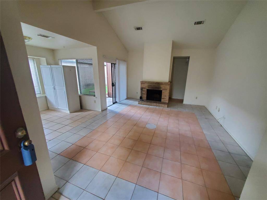 Front entryway with raised ceilings and a unique tile design.
