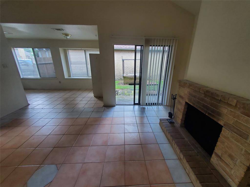 Fireplace for the cold winters and easy access to the backyard.