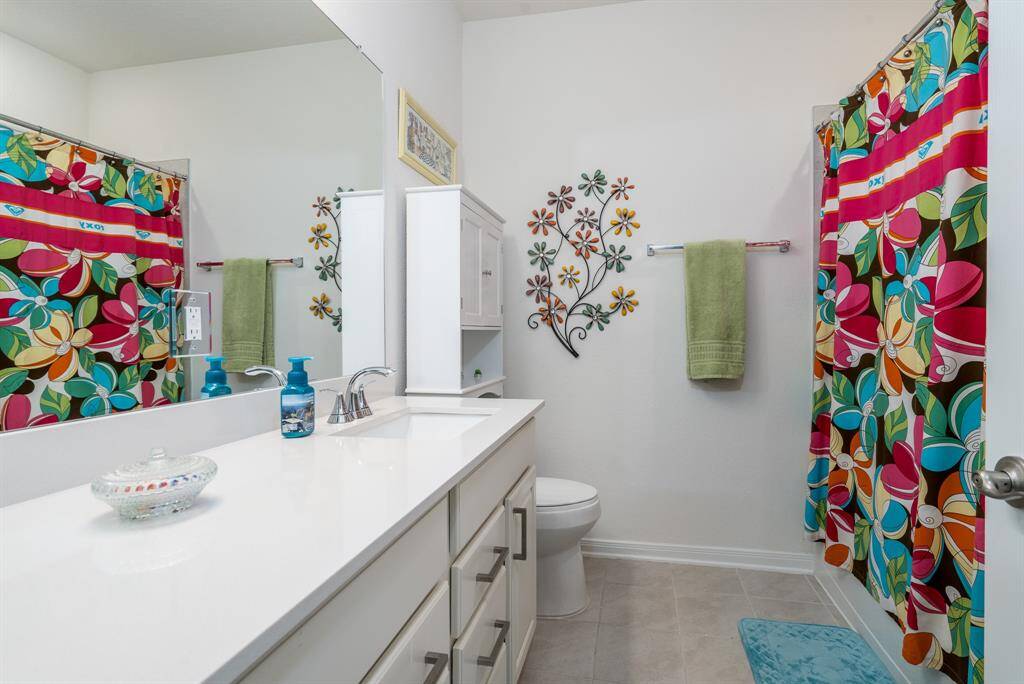 Secondary bathroom with plenty of counter-space