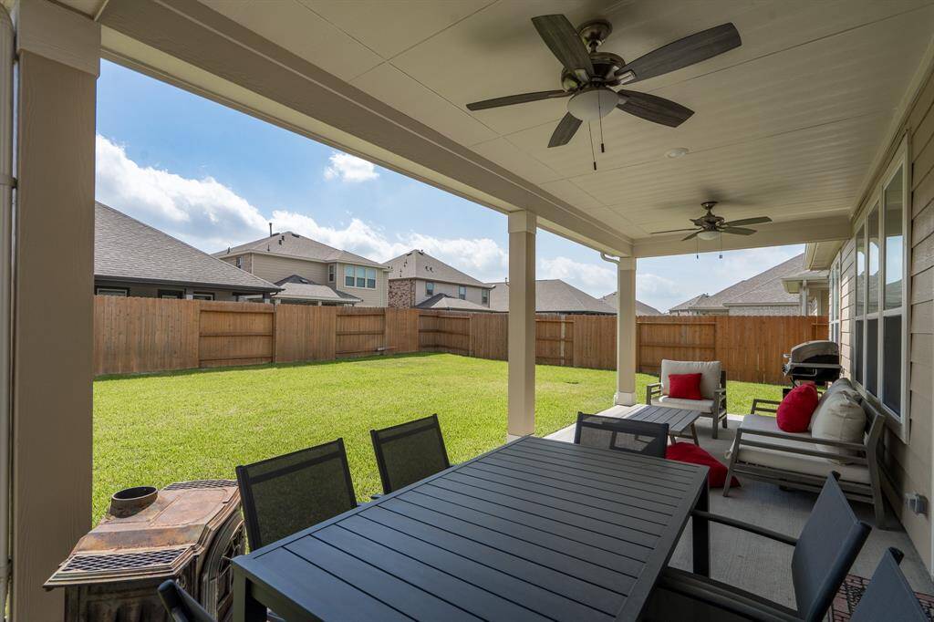Huge covered patio with dual ceiling fans
