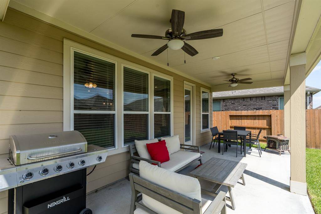 Huge covered patio with dual ceiling fans