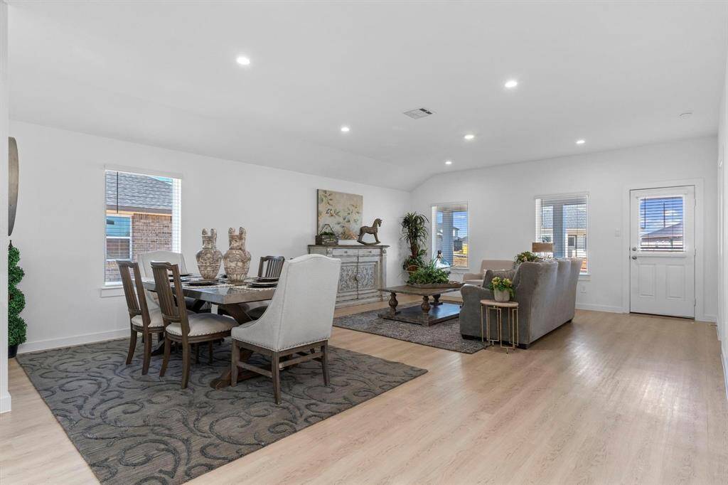 Dining area open to the living room. All photos are representative of the home