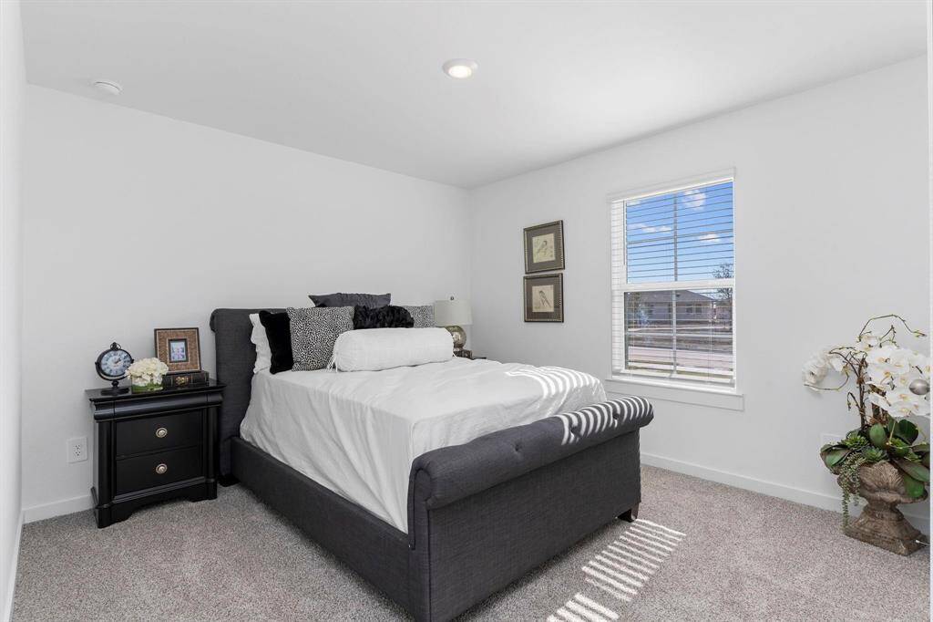Secondary bedrooms. All photos are representative of the home