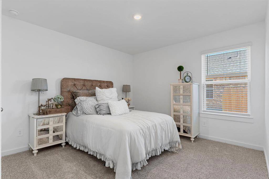 Secondary bedrooms. All photos are representative of the home