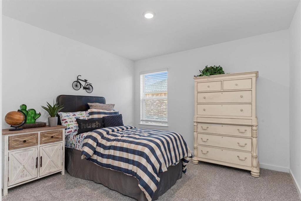 Secondary bedrooms. All photos are representative of the home