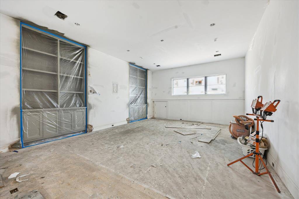 Upstairs Game Room with Built-Ins and in- wall TV box. White Oak floors throughout the second floor.