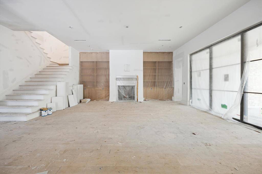 Enjoy cozy nights by the Wood Burning fireplace. Doors by RAM lead you to the Pavilion and backyard.