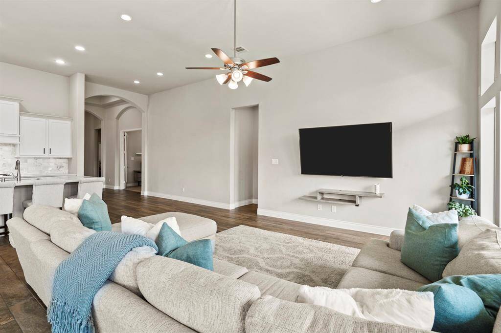 Looking back toward the kitchen and hallway, this angle emphasizes the home's open layout and clean transitions between spaces.