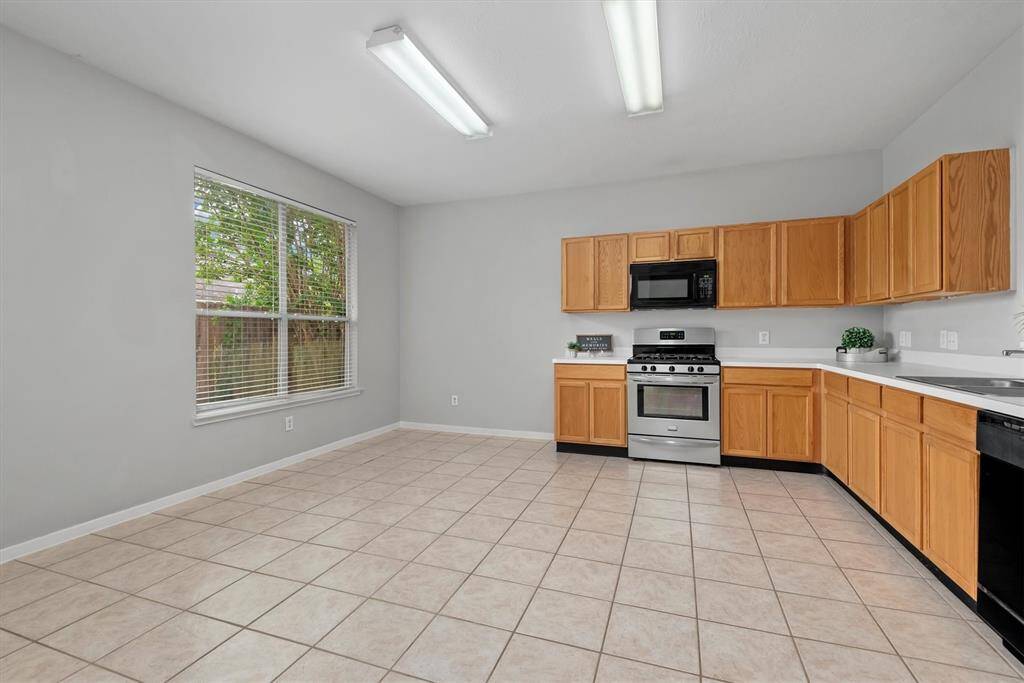 The left area here is perfect for an eat-in dining space and has great windows that let in plenty of natural light