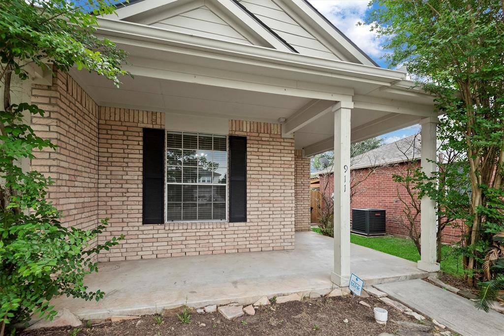 The quiet, covered front porch is perfect for a couple of chairs and an morning cup of coffee or evening glass of wine.