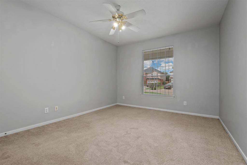 Here is the last of the bedrooms.This one overlooks the front yard. All rooms have ceiling fans for those warm summer months that are just around the corner.